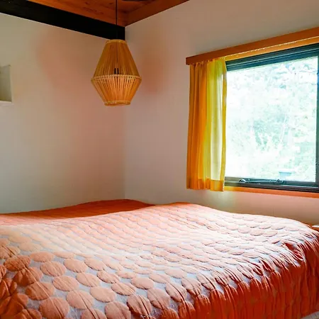 Unique House Surrounded By Willow Trees