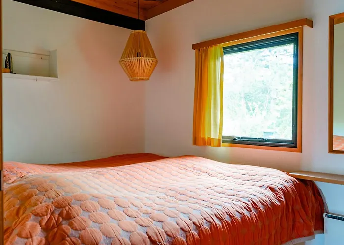 Unique House Surrounded By Willow Trees